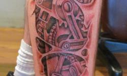 black grey robot mechanics leg tattoo guy man